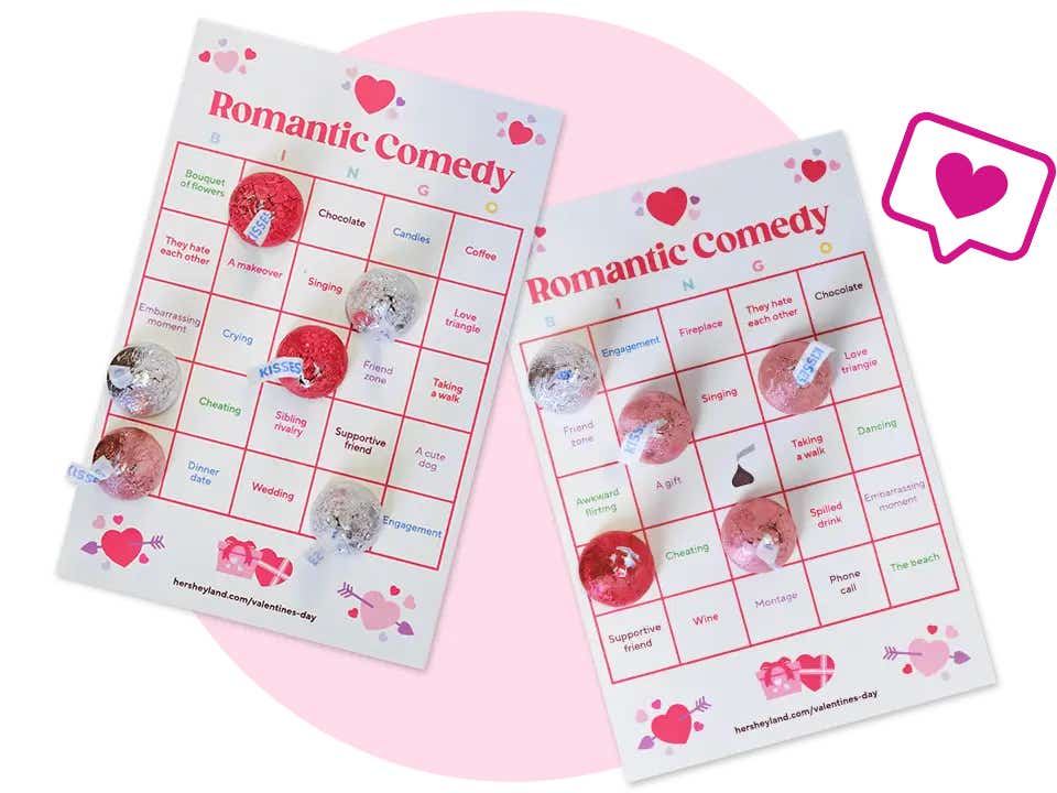 pair of romantic comedy bingo cards topped with hersheys kisses candies